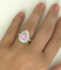 Looks like a Pink Diamond Sapphire and Diamond Ring in 14k white gold