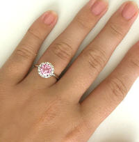 Pink Sapphire and Diamond Ring on the hand
