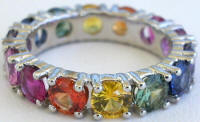 Round natural rainbow sapphire eternity ring in platinum