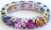 Round natural rainbow sapphire eternity ring in platinum