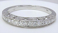 Heart-shaped natural ruby engagement ring in 14k white gold with vintage styling and sparkling diamond accents.