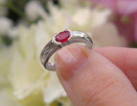 Oval Natural Ruby Solitaire Ring in solid 14k white gold band. East West Semi Bezel Set Ruby