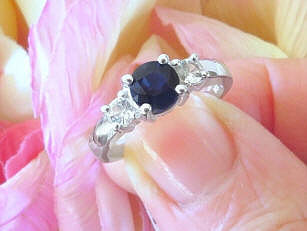 Natural Round Dark Blue Sapphire and White Sapphire Three Stone Sapphire Engagement Ring in 14k white gold