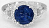 Round Blue Sapphire and Diamond Halo Ring in 14k white gold