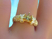 A stunning 14k yellow gold ring with baguette and round diamonds, perfect for adding glamour and style.
