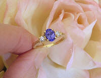 3 Stone Oval Genuine Tanzanite and Round Diamond Engagement Ring in 14k yellow gold for sale
