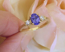 3 Stone Oval Natural Tanzanite and Round Diamond Engagement Ring in 14k yellow gold carved band