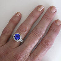 Fine Round Tanzanite and Diamond Halo Ring in 14k white gold