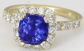 Cushion Tanzanite and Diamond Halo Ring in 14k yellow gold