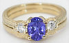 3 Stone Tanzanite and White Sapphire Ring with carved band in 14k