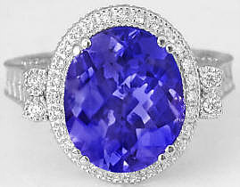 oval tanzanite and diamond halo ring in 14k white gold