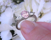 Natural Oval Pink Sapphire and Pear White Sapphire Three Stone Engagement Ring in simple white gold band for sale