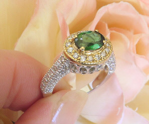 East West Natural Green Tourmaline and Diamond Halo Ring in two tone 14k white and yellow gold for sale