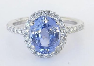 A stunning 2.98-carat unheated Ceylon sapphire diamond halo ring in 14k white gold.