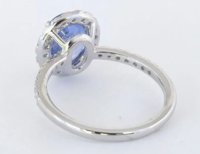Exquisite natural unheated Ceylon sapphire diamond halo ring in 14k white gold, showcasing a rare 2.98-carat cornflower blue sapphire surrounded by dazzling diamonds.