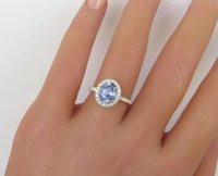 A stunning Ceylon sapphire diamond halo ring in 14k white gold, showcasing natural beauty and brilliance.