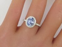 A stunning 2.98-carat unheated Ceylon sapphire diamond halo ring in 14k white gold.
