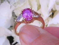 Untreated Natural Pink Sapphire Engagement Ring with Trillion White Sapphire Sides with a 14k yellow gold band