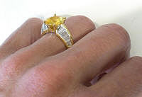 Vibrant Round Yellow Sapphire and Baguette Diamond Rings in 18k yellow gold