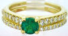 emerald engagement rings and wedding band in yellow gold