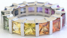 Princess cut natural rainbow sapphire eternity ring in gold