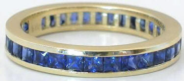 Channel Set 3 ctw Princess Cut Sapphire Eternity Band in Yellow Gold