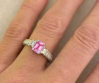 Vintage Style Emerald Cut Pink Sapphire Diamond Ring in 14k white gold on the hand