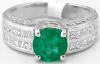 Natural Round Emerald and Diamond Ring set in wide 18k white gold band