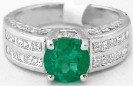 Natural Round Emerald and Diamond Ring set in wide 18k white gold band