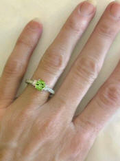 Antique Style Peridot and Oval Diamond Ring in 14k white gold