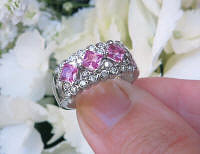 Natural Pink Sapphire Anniverary Band with Diamonds. Diagonal set princess cut sapphires in solid 14k white gold for sale