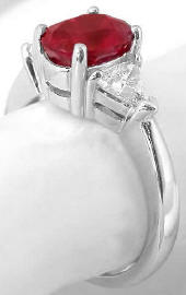 Genuine Oval Burmese Ruby and Trillion Diamond Ring in 18k white gold