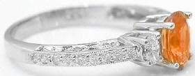 Oval Orange Sapphire and Diamond Encrusted Ring in 14kk white gold