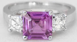 Princess cut three stone multigemstone engagement ring in platinum