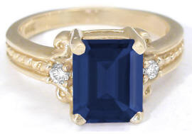 3.06 ctw Emerald Cut Sapphire and Diamond Engagement Ring in 14k yellow gold