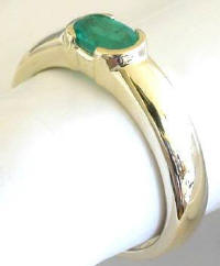 East West Set Emerald Solitaire Ring in 14k yellow gold