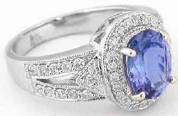 Halo oval cut tanzanite engagement ring in 14k white gold