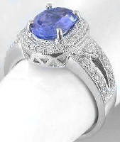 Halo oval cut tanzanite engagement ring in 14k white gold