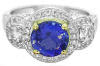 Round Tanzanite Halo Ring in white and yellow gold