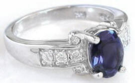 Oval cut iolite engagement ring in 14k white gold